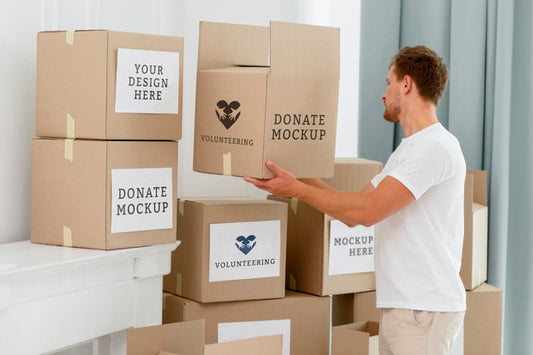 Free Side View Of Male Volunteer With Donation Boxes Psd