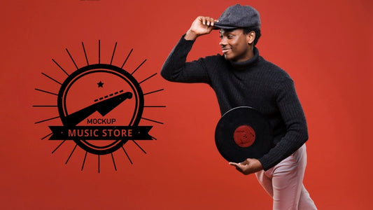 Free Side View Of Man Holding Vinyl Disk For Music Store Mock-Up Psd