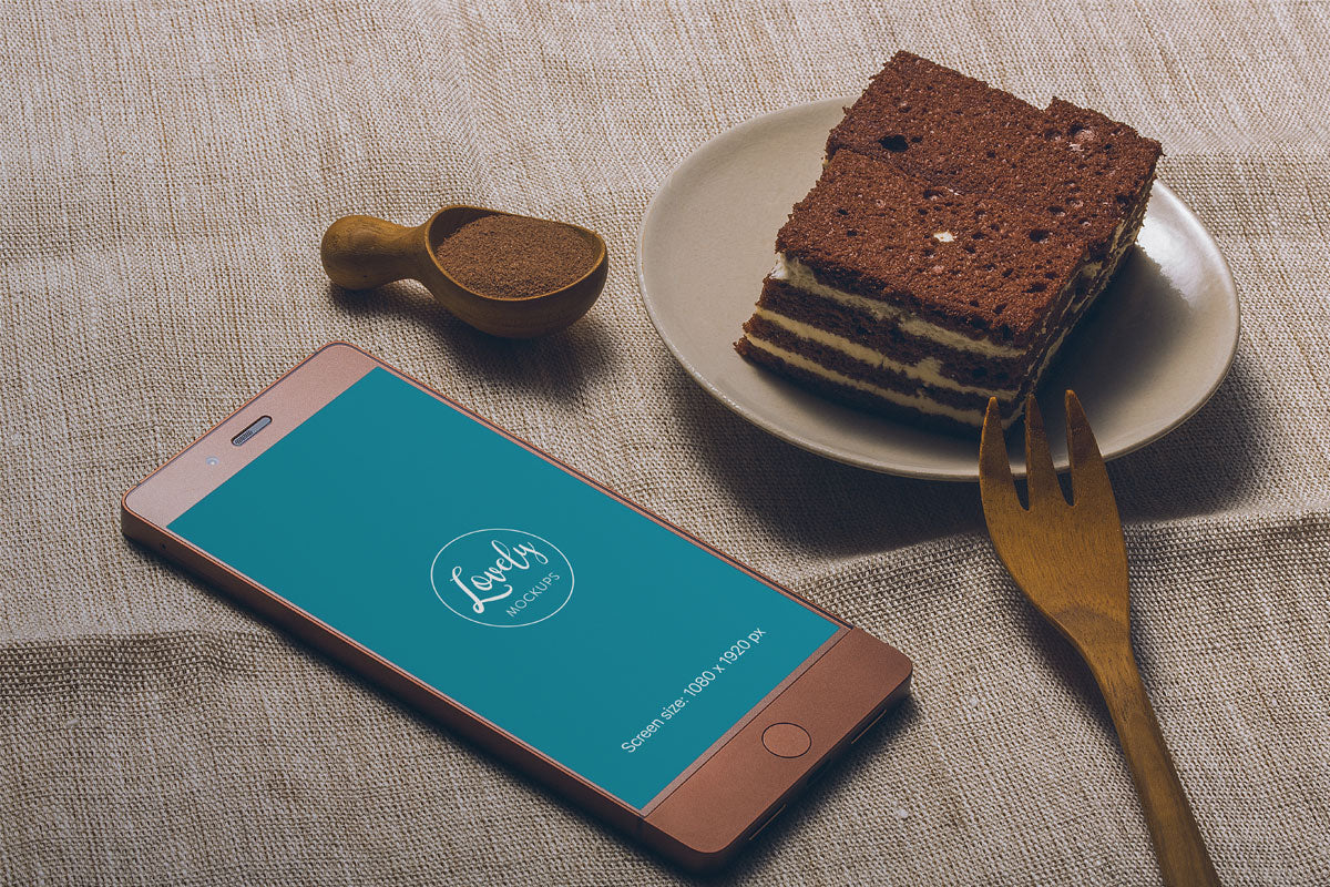 Free Smartphone and Tasty Cake on a Table