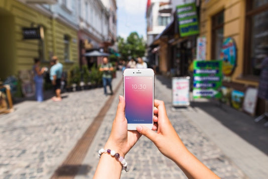 Free Smartphone Mockup In Busy Street Psd