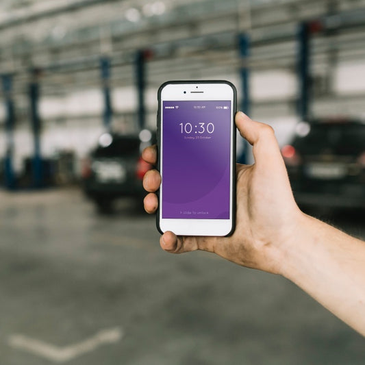 Free Smartphone Mockup In Car Factory Psd