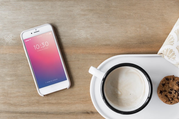 Free Smartphone Mockup Next To Coffee Psd