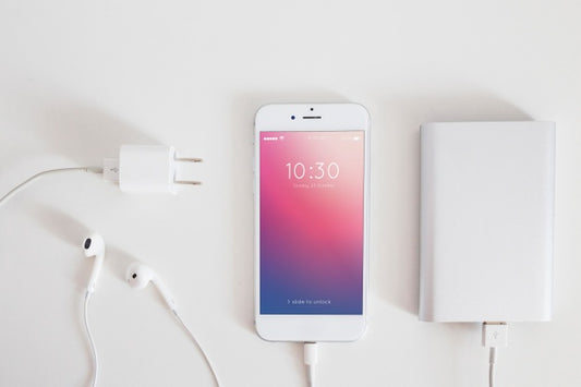 Free Smartphone Mockup With Charging Cable And Earphones Psd