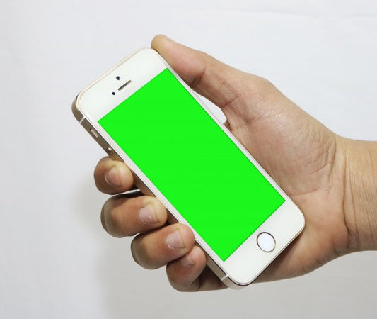 Free Smartphone with Green Screen in Hand PSD Mockup