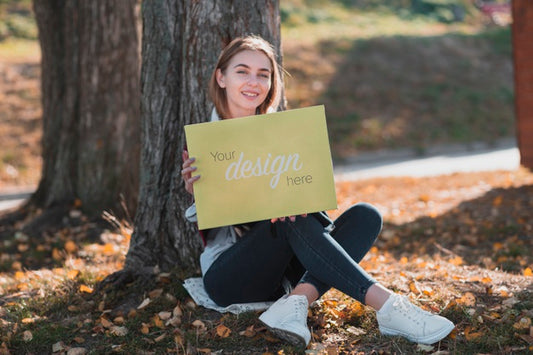 Free Smiley Blonde Girl Holding A Banner Mock-Up Psd