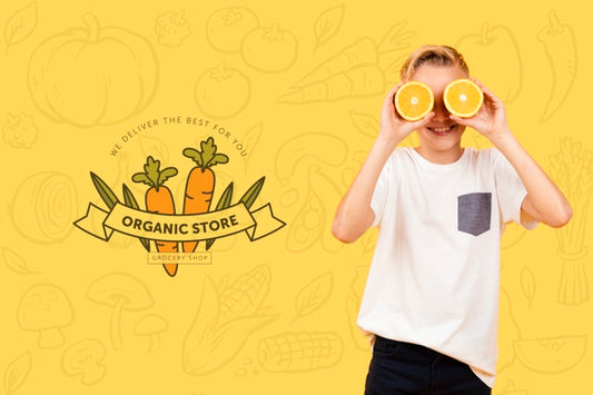 Free Smiley Child Posing With Oranges Over Eyes Psd