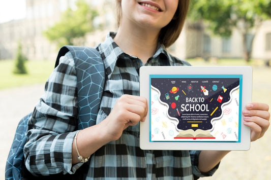 Free Smiley Girl Holding A Tablet Mock-Up Psd