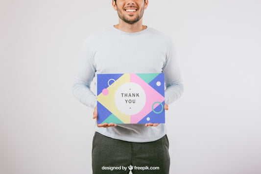 Free Smiley Man Holding Poster Mock Up Psd
