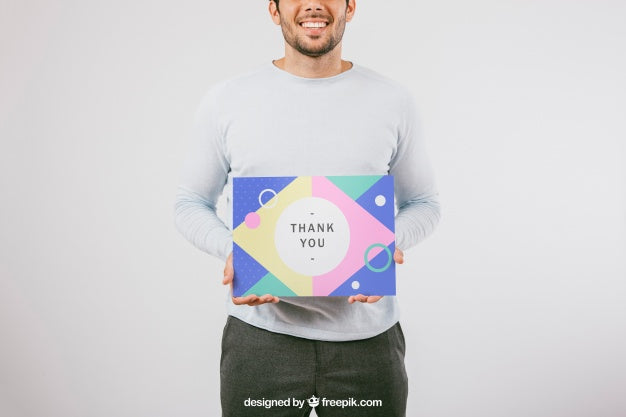 Free Smiley Man Holding Poster Mock Up Psd