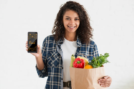 Free Smiley Woman With Phone And Vegetables Psd