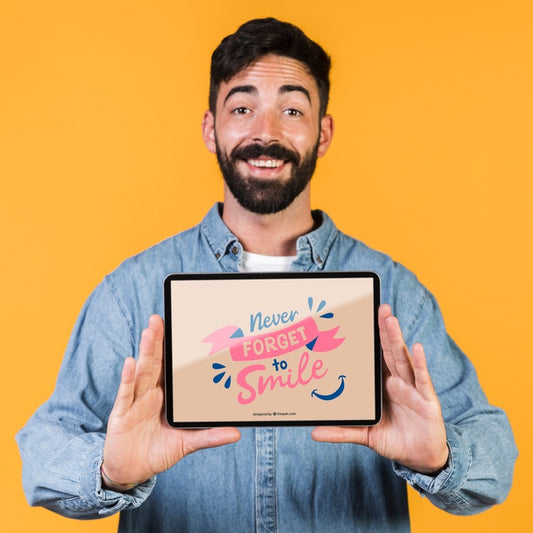 Free Smiling Bearded Man Presenting A Tablet Mock Up Psd