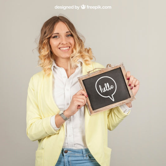 Free Smiling Woman Presenting Slate Psd