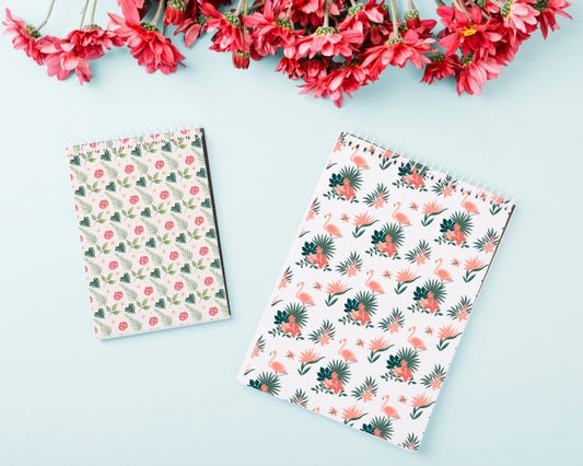 Free Spiral Notepad Mockup With Flowers On Top Psd
