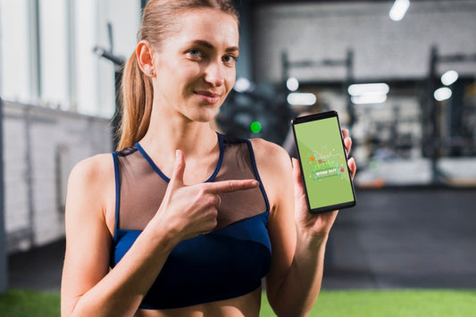 Free Sporty Woman Pointing At Smartphone Mockup Psd