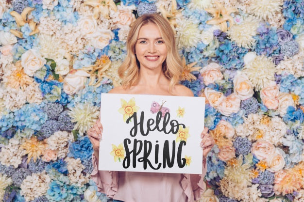 Free Spring Concept With Woman Holding Paper Mockup Psd