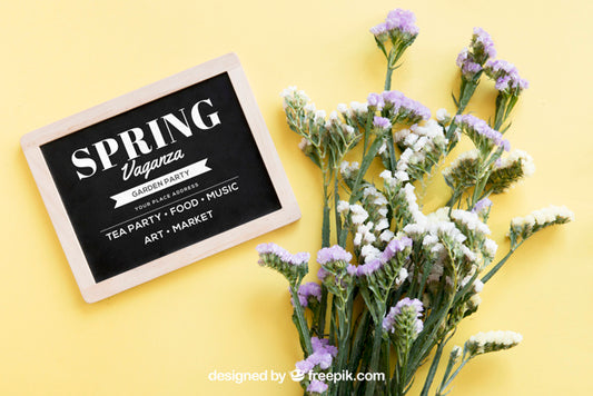 Free Spring Mock Up With Slate Next To Flowers Psd