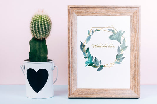 Free Spring Mockup With Wooden Frame And Cactus Psd