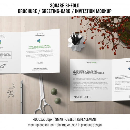 Free Square Bi-Fold Brochure Or Greeting Card Mockup On Creative Workspace Psd
