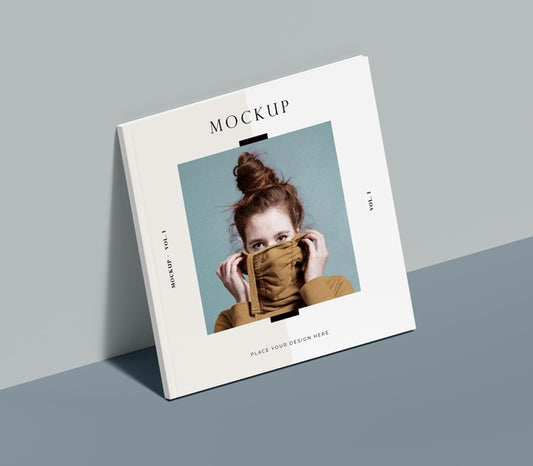 Free Square Book With Woman Editorial Magazine Mock-Up Leaning On The Wall Psd