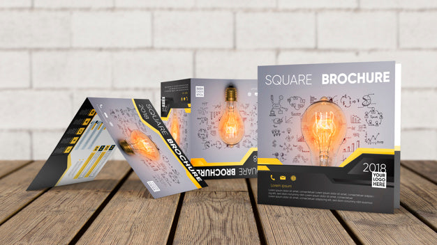 Free Square Brochure Mockup On Wooden Surface Psd