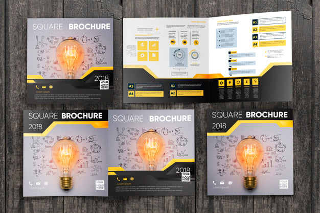 Free Square Brochure Mockup On Wooden Surface Psd