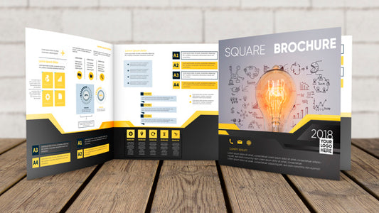 Free Square Brochure Mockup On Wooden Surface Psd