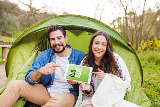 Free Summer Camp Mockup With Couple Pointing At Tablet Psd