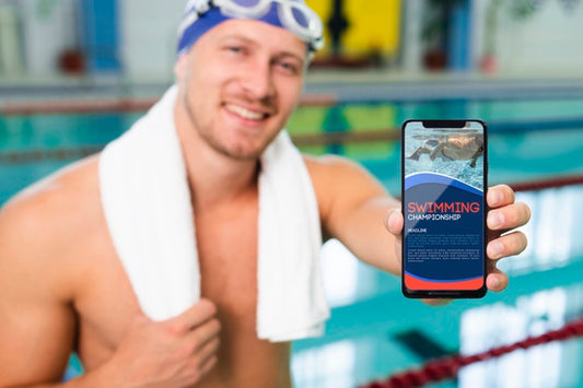 Free Swimmer In A Pool House Holding A Mock-Up Mobile Phone Psd