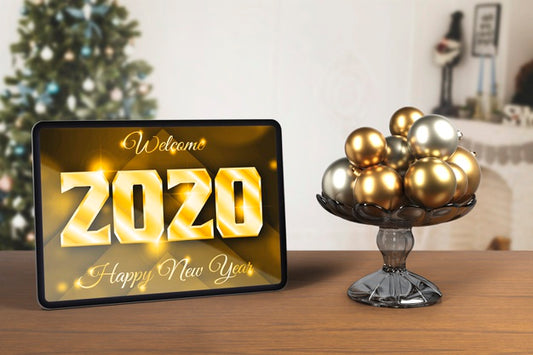 Free Tablet Beside Tray With Globes For New Year Psd