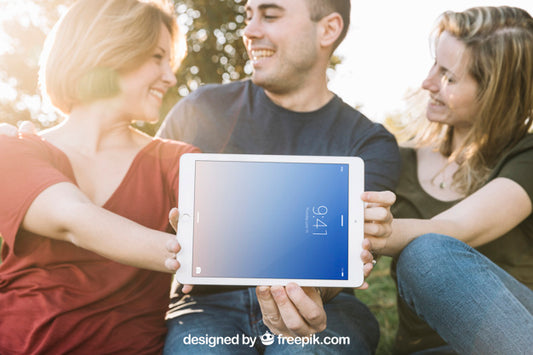 Free Tablet Mockup With Friends Outdoors Psd