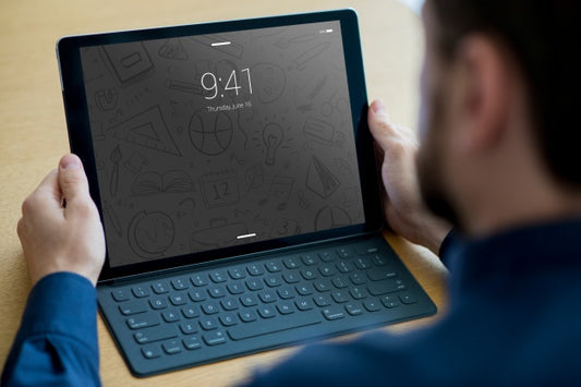 Free Tablet Mockup With Keyboard And Man Psd