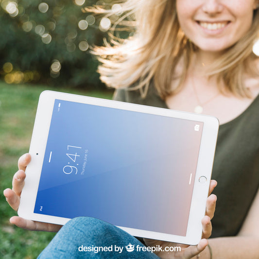 Free Tablet Mockup With Smiling Woman Outdoors Psd