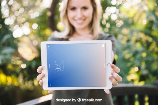 Free Tablet Mockup With Woman In Nature Psd