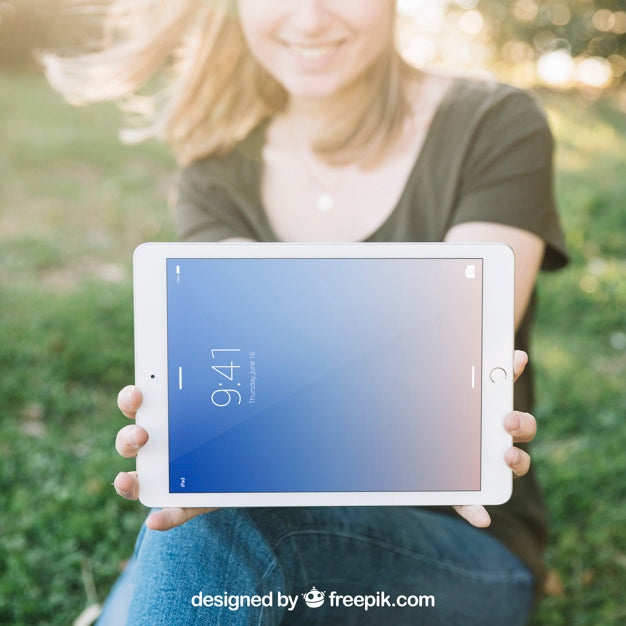 Free Tablet Mockup With Woman Outdoors Psd