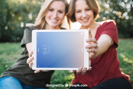 Free Tablet Mockup With Women In Nature Psd