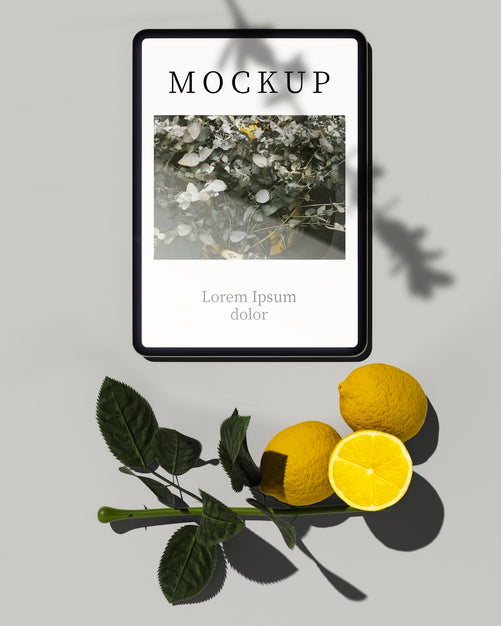 Free Tablet With Citrus Fruit And Leaves Psd