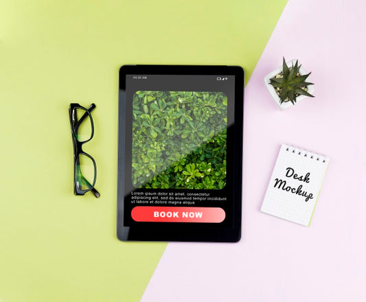 Free Tablet With Plant And Notebook On Desk Psd