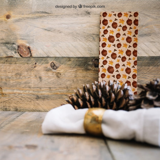 Free Thanksgiving Mockup With Banner And Pine Cone Psd
