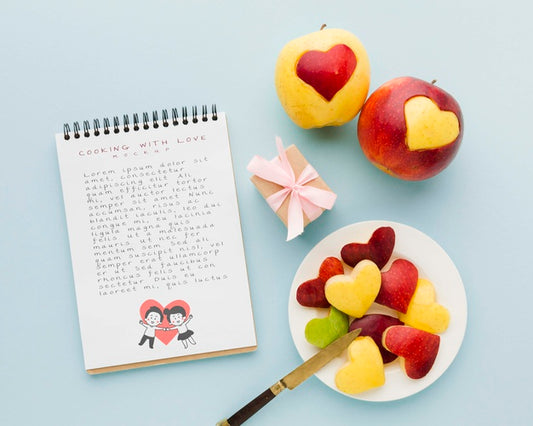 Free Top View Apples And Notebook Arrangement Psd