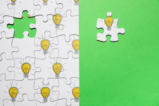 Free Top View Arrangement With Puzzle On Green Background Psd