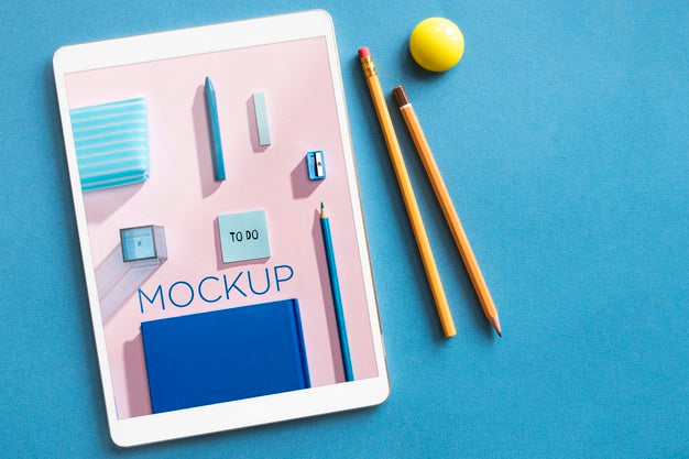 Free Top View Arrangement With Tablet And Pencils Mock-Up Psd