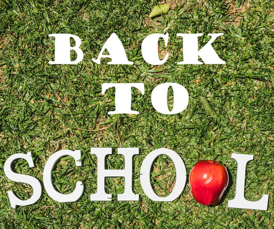 Free Top View Back To School Message On Grass Psd