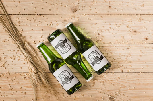 Free Top View Beer Bottles With Wooden Background Psd