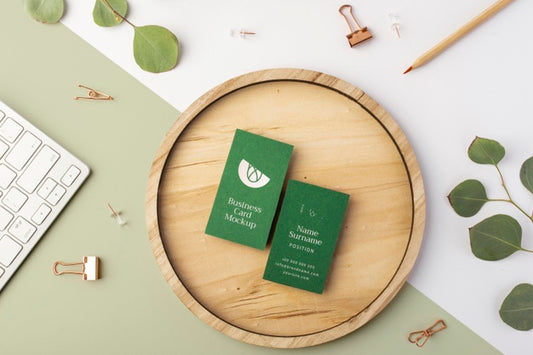 Free Top View Business Cards On Wood With Leaves Psd