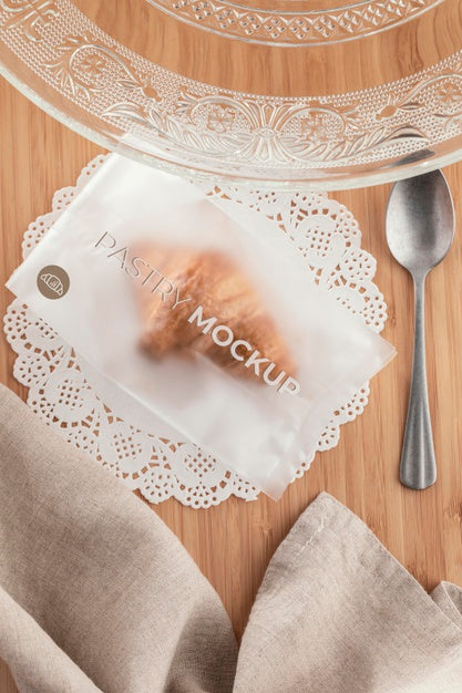 Free Top View Croissant In Transparent Packaging Psd