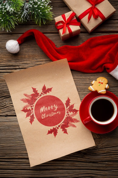 Free Top View Cup Of Coffee With Merry Christmas Letter And Santa'S Hat Psd