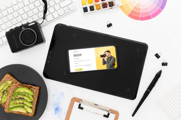 Free Top View Desk With Phone Mock-Up And Avocado Toast Psd