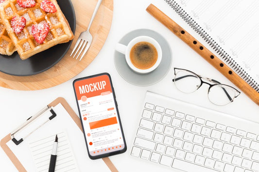 Free Top View Desk With Waffles And Phone Mock-Up Psd