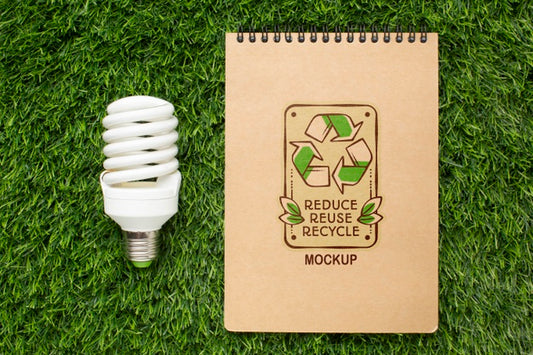 Free Top View Eco Notebook Mock-Up With Lightbulb Psd