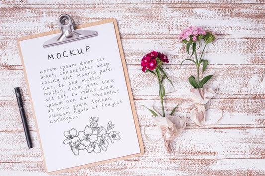Free Top View Flowers With Clipboard Mock-Up Psd